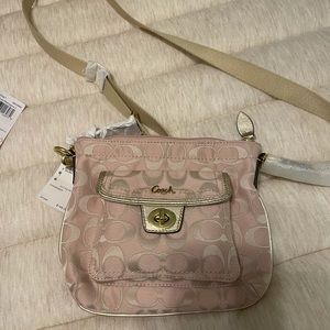 Two brand new coach purses.